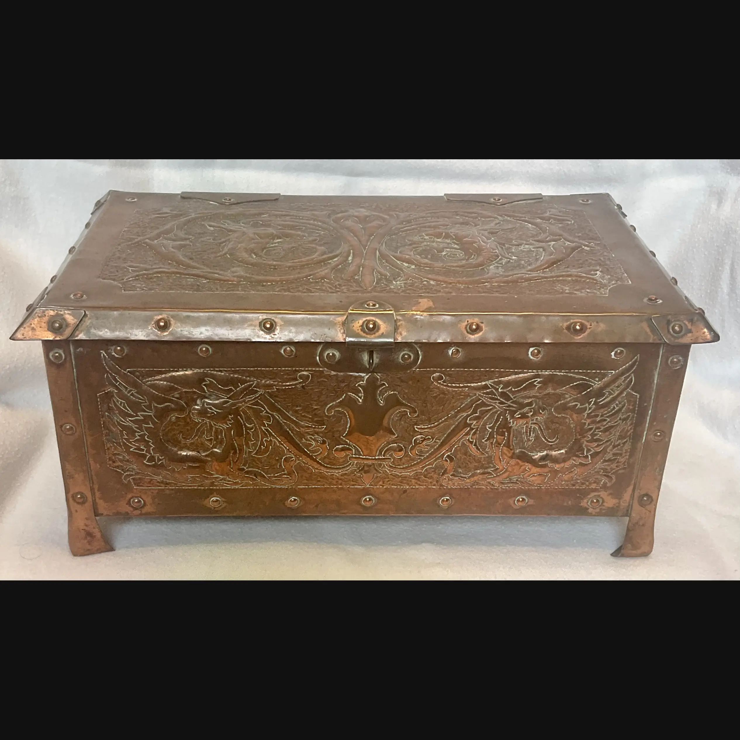 large arts and crafts copper jewel casket with grotesques and griffens velvet lined c1910