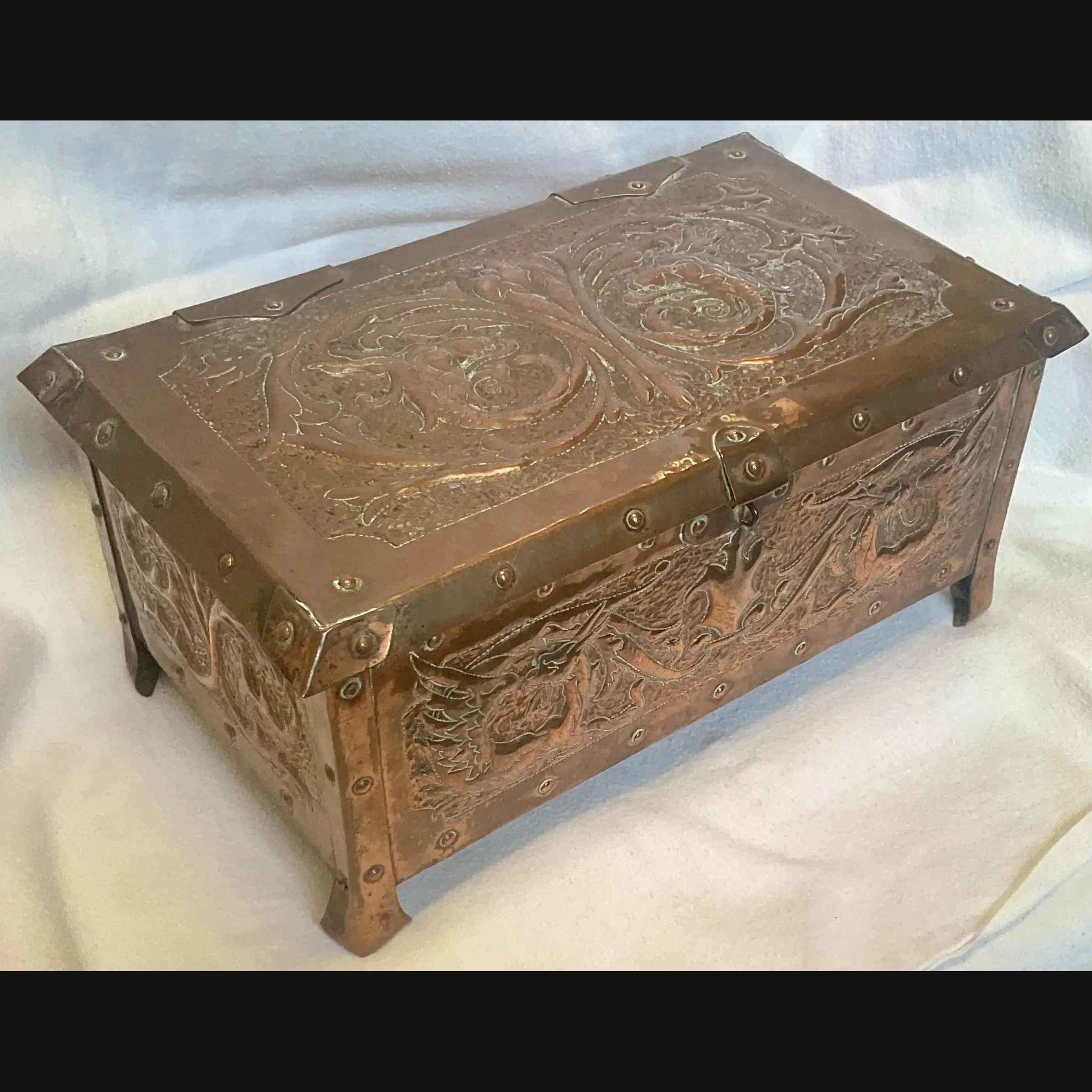 large arts and crafts copper jewel casket with grotesques and griffens velvet lined c1910