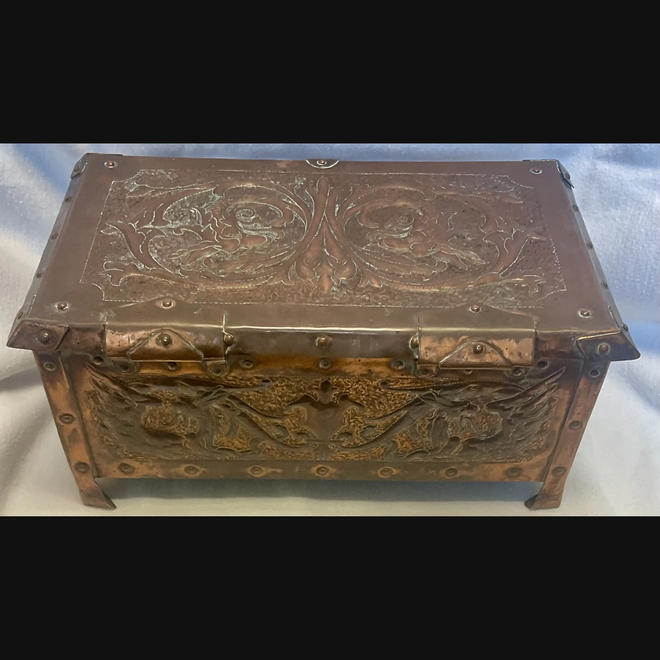 large arts and crafts copper jewel casket with grotesques and griffens velvet lined c1910