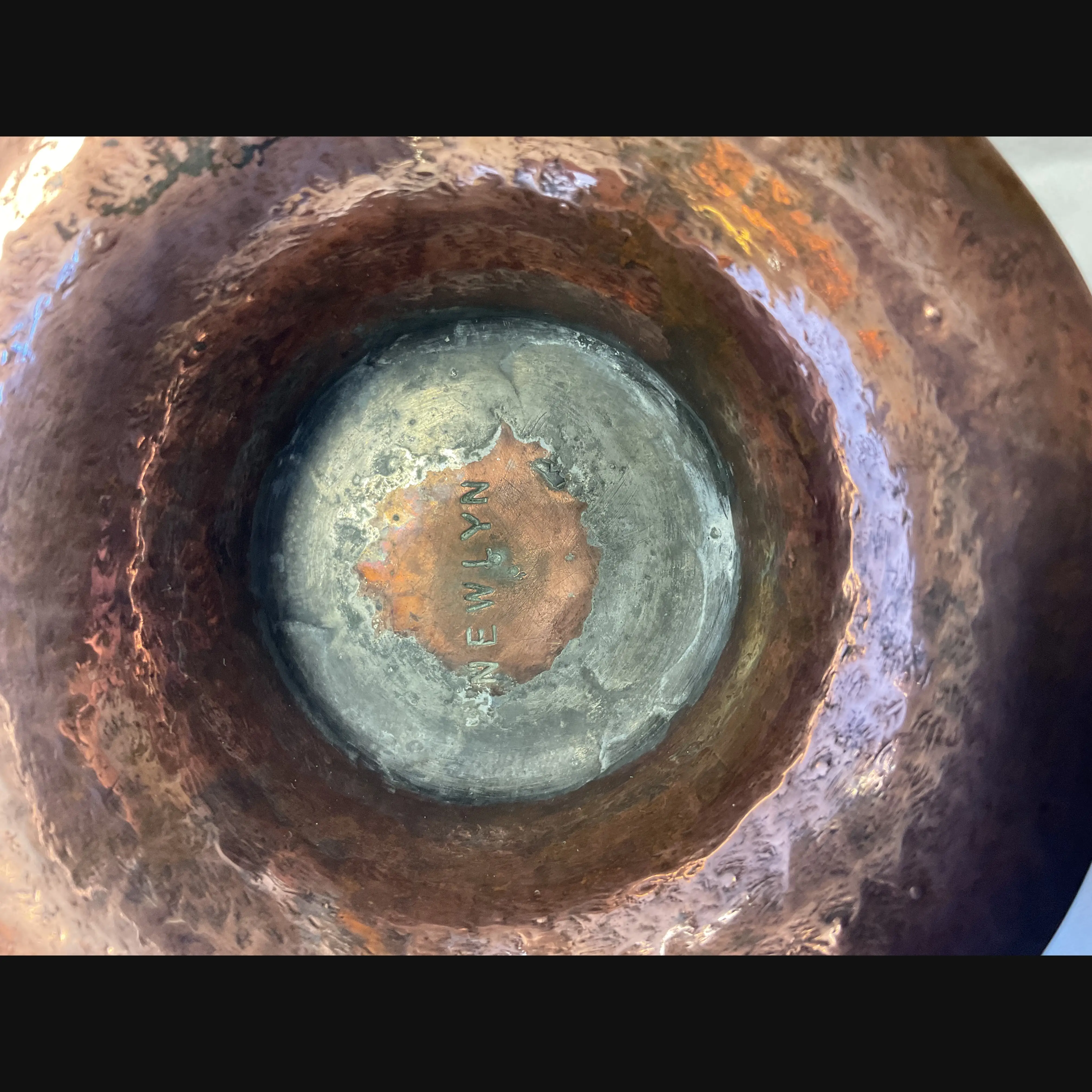 newlyn cornish arts and crafts copper footed bowl with repeating fish and seaweed design c1910