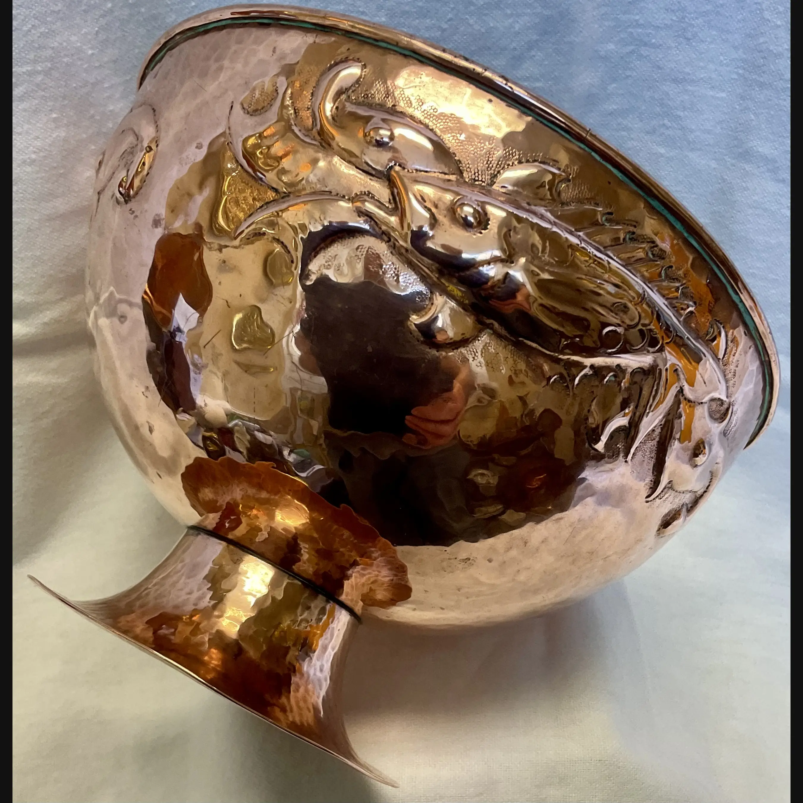 newlyn cornish arts and crafts copper footed bowl with repeating fish and seaweed design c1910