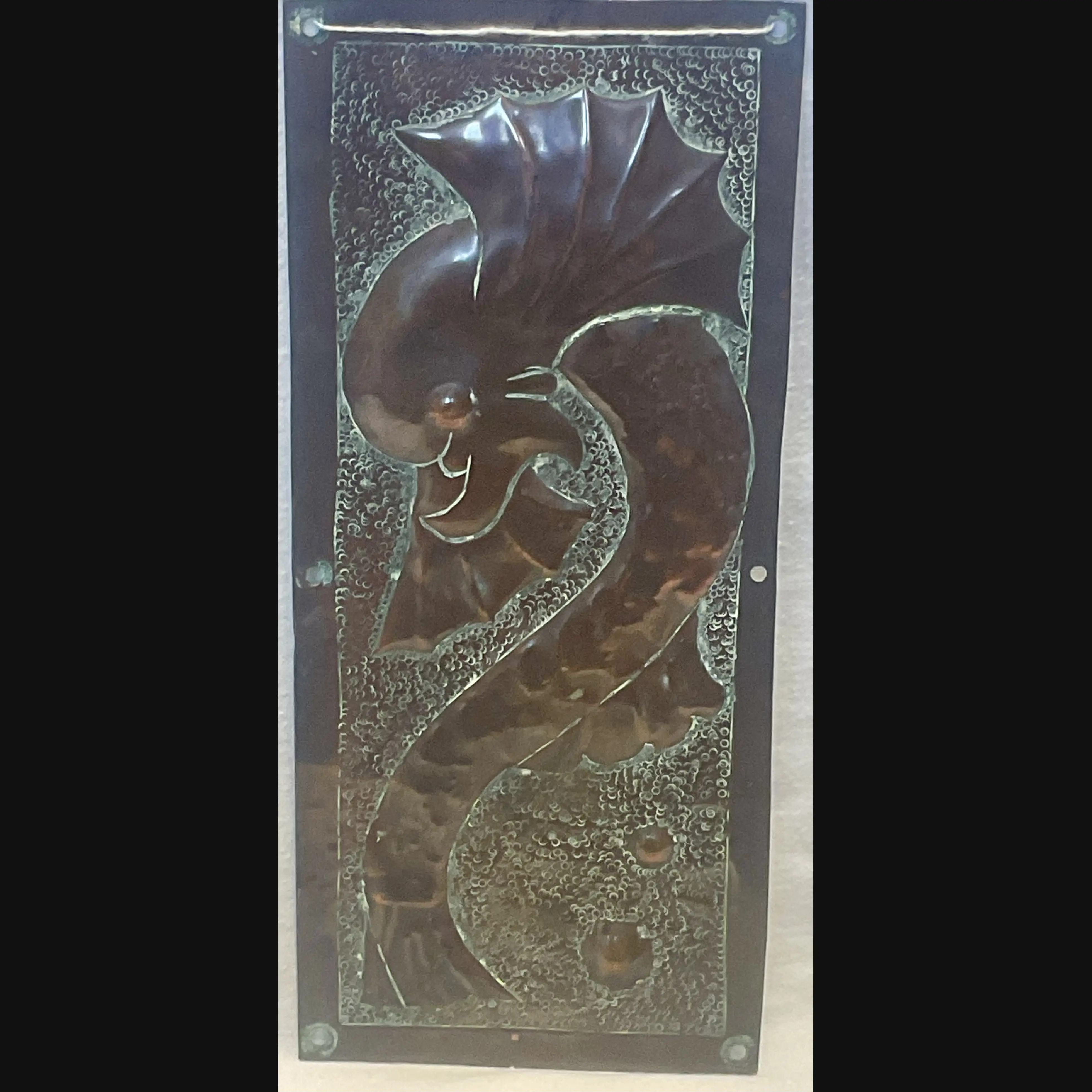arts and crafts grotesque sea serpent door finger plate two