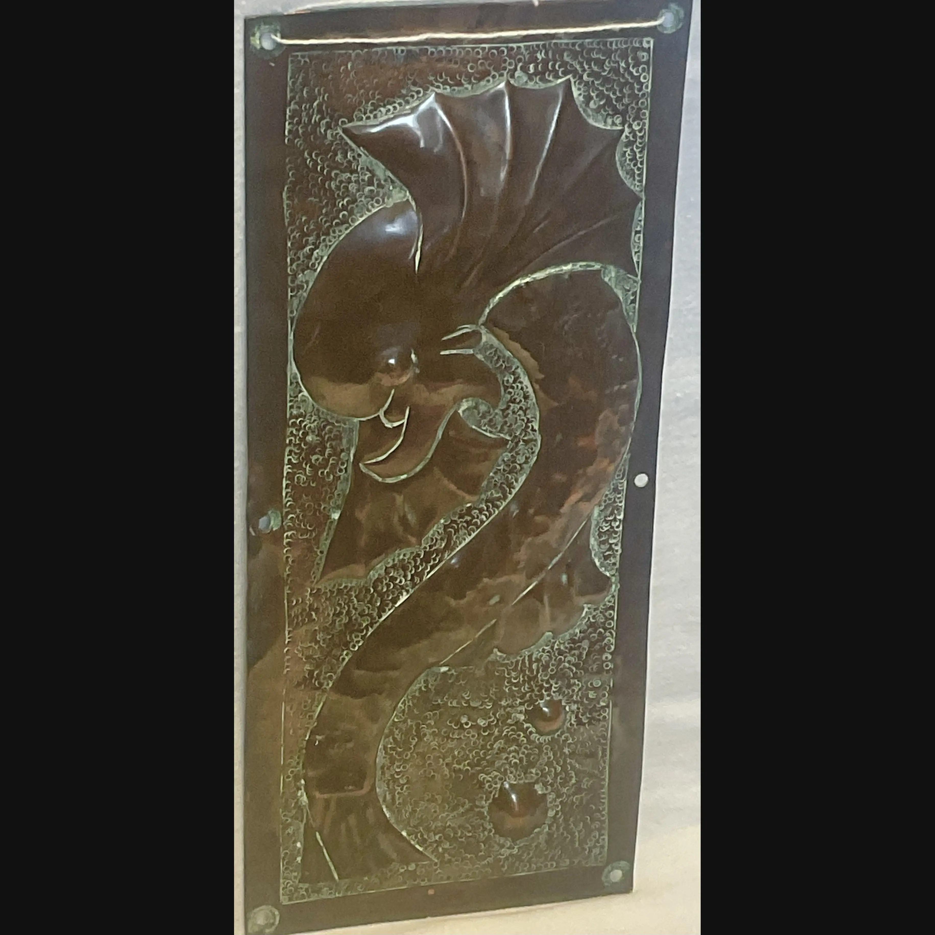 arts and crafts grotesque sea serpent door finger plate two