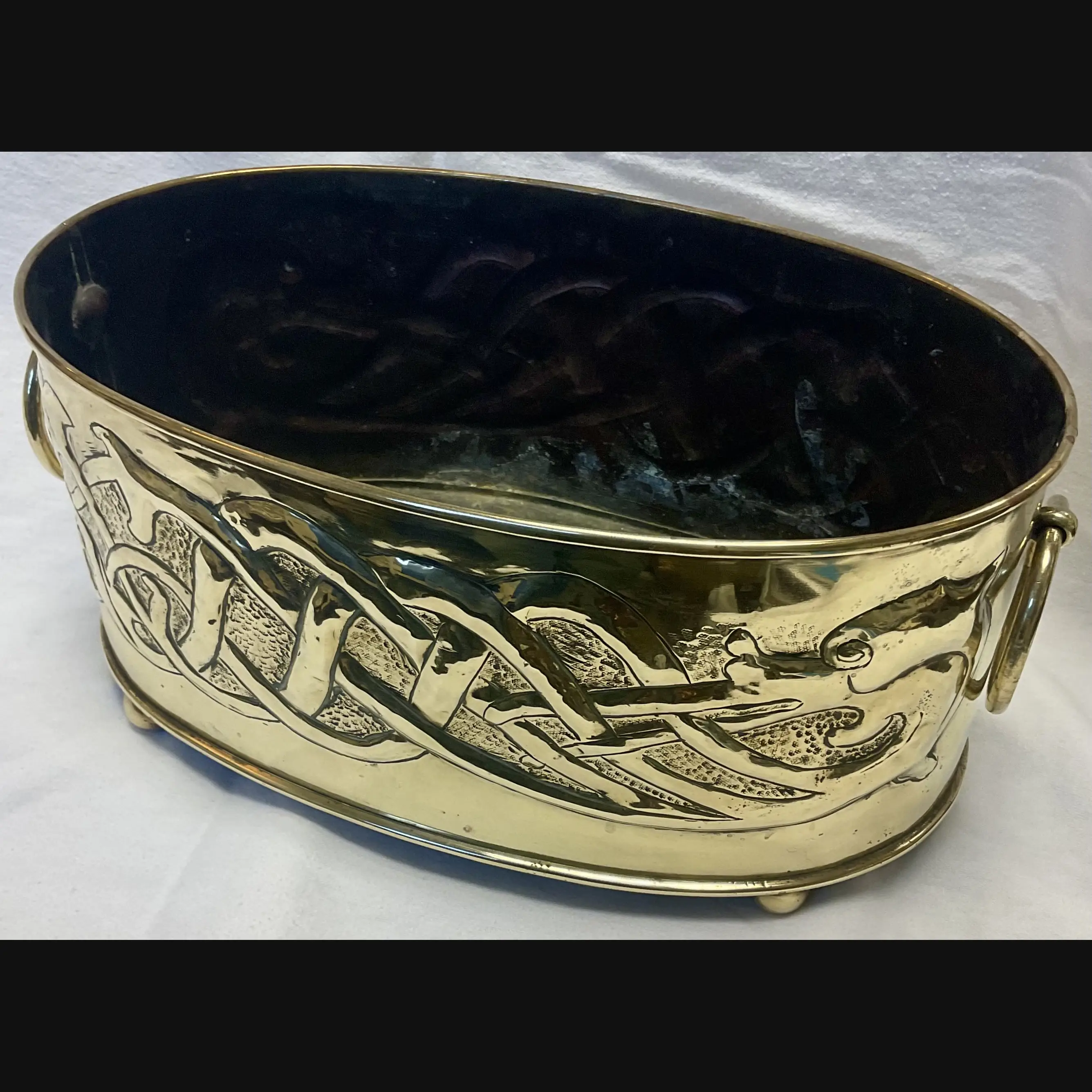 large scottish arts and crafts entwined celtic serpent brass planter with ring handles c1910