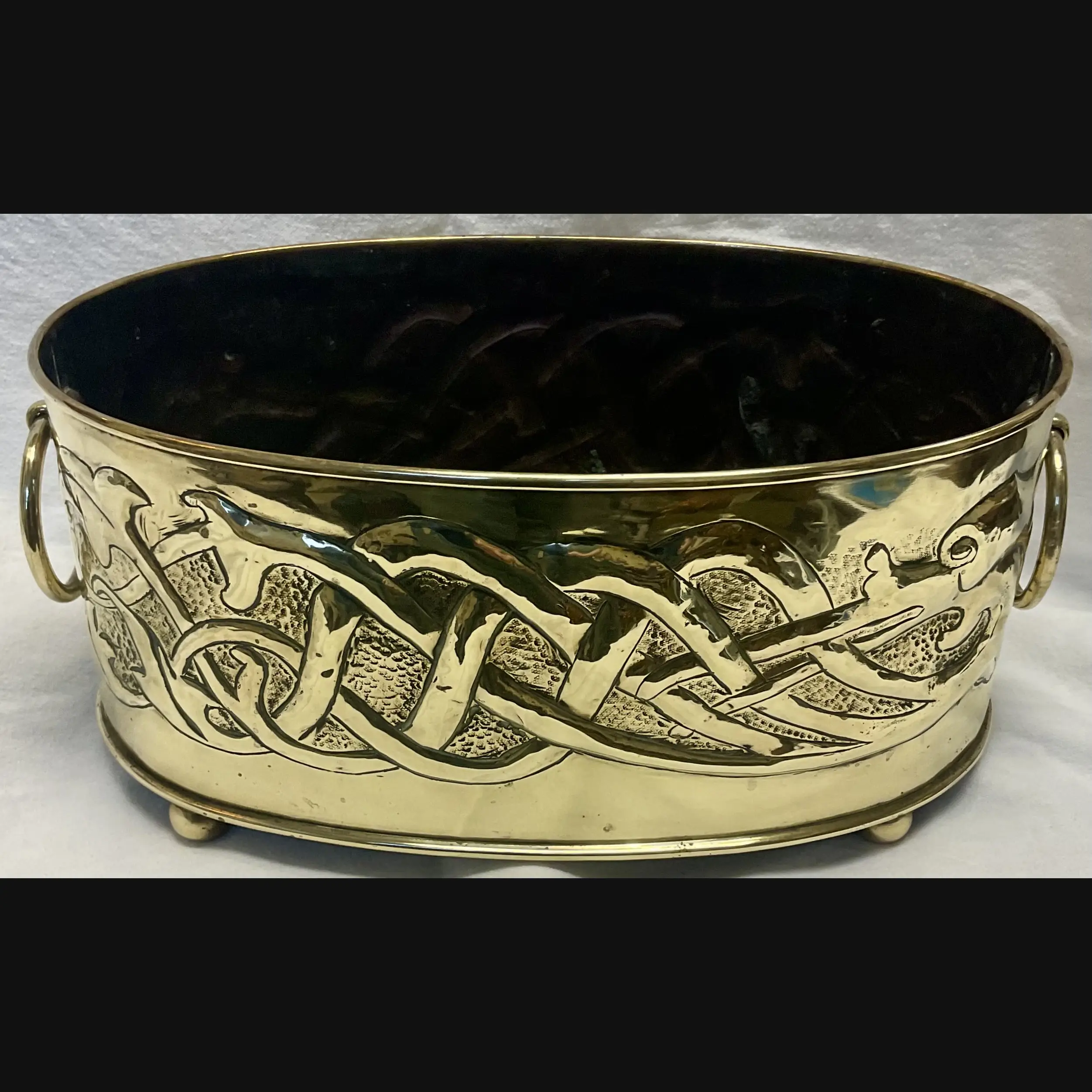 large scottish arts and crafts entwined celtic serpent brass planter with ring handles c1910